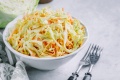 traditional-coleslaw-salad-with-fresh-sliced-carrots-cabbage-white-bowl-with-copy-space_633077-407.jpg